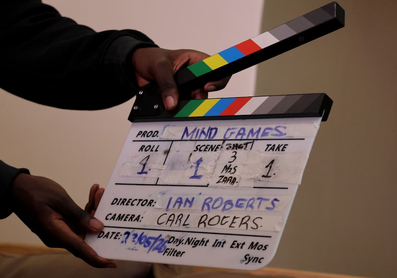 A clapperboard held in frame at the start of a take